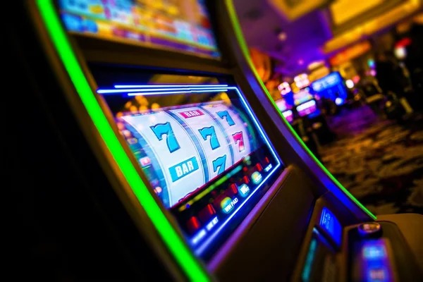 slot775 Mega Sevens mobile game screen with reel controls and account balance